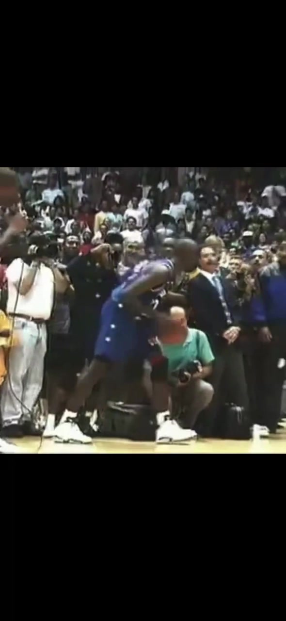 Michael Jordan with an ankle-touching dunk at Magic Johnsons offseason charity game in Los Angeles 1991
