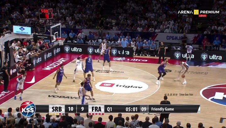 Serbia's Nikola Milutinov locks up Wembanyama forces a turnover and starts a three on one fast break which ends in a one-handed alley-oop slam