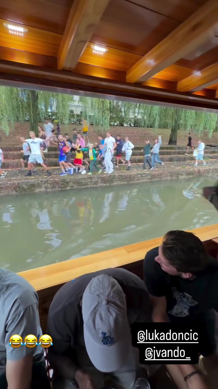 Jarred Vanderbilt throws a T-shirt at fans but it goes into the river and one of the fans jumps in afterward and the Lakers players are shocked by it going nuts
