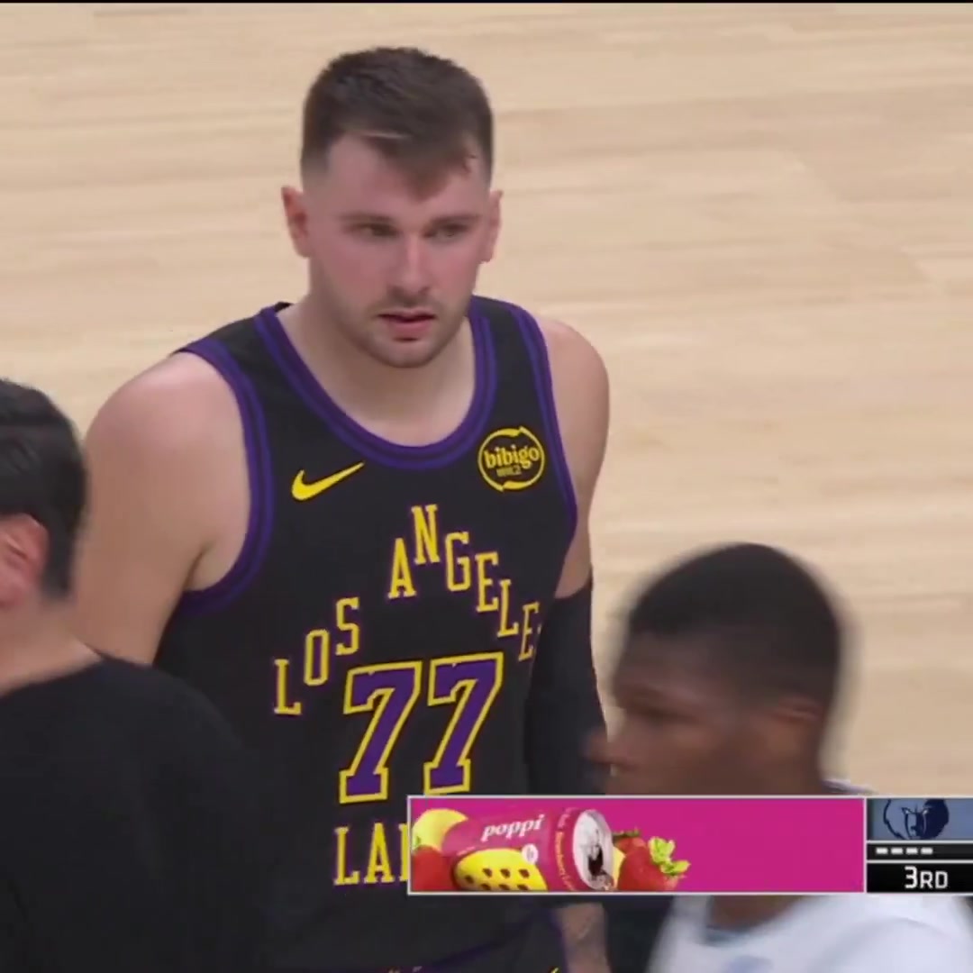 Injury During a timeout Luka Doni gets hit on the arm by a Lakers assistant coach and calls for medical attention