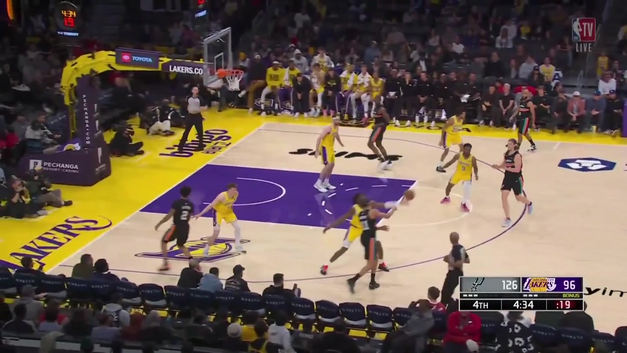 Bronny James blocks Kelly Olynyk at the rim and then shoots a 3 over him
