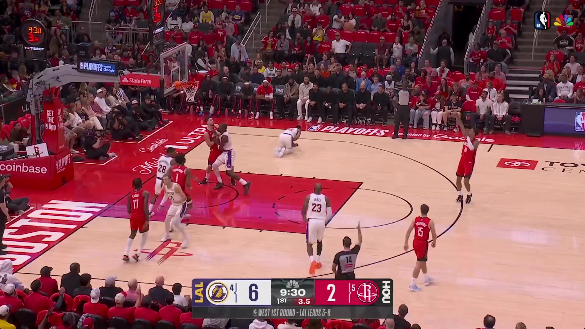 Deandre Ayton contests a three after Marcus Smart went down