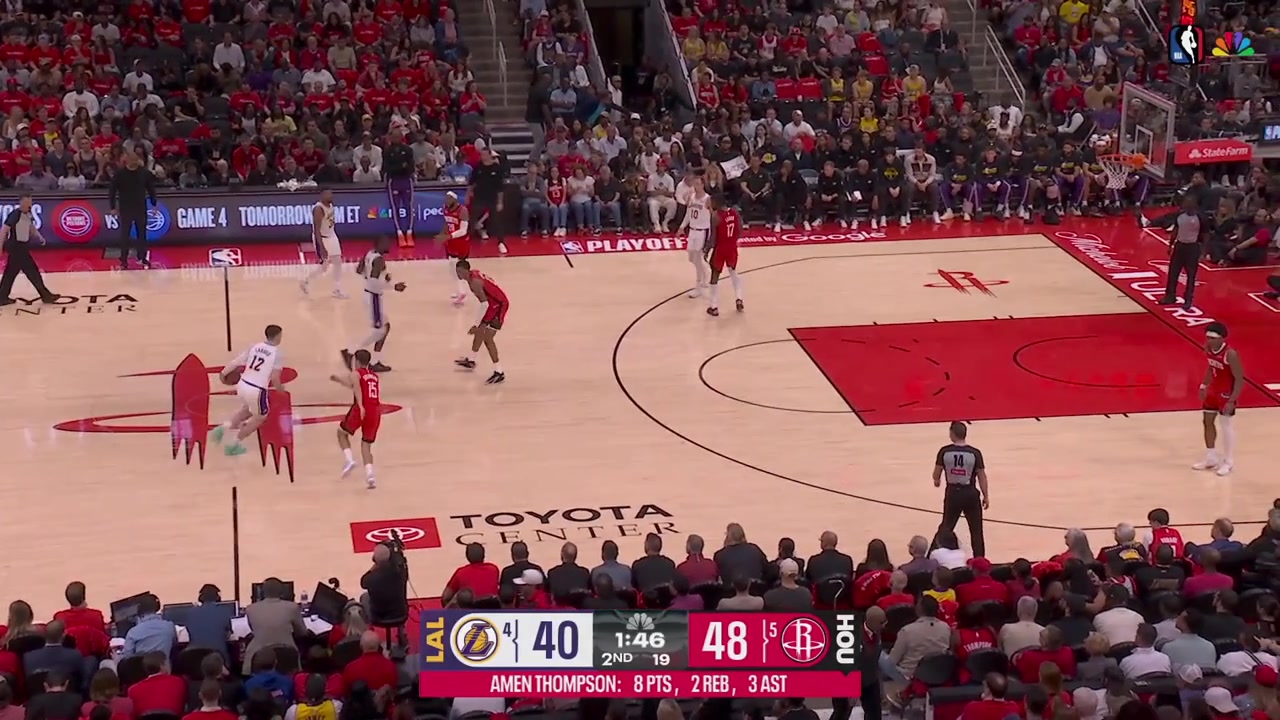 Marcus Smart banks in the shot from just inside halfcourt over Josh Okogie off the whistle