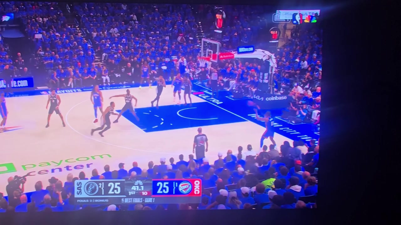 Wemby attempts to block the vision for a three point attempt