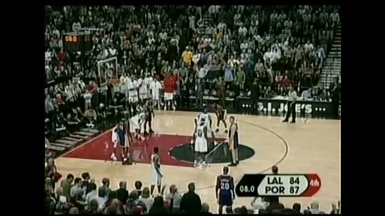 Ruben Patterson who anointed himself as the Kobe Stopper tries his best to stop a Kobe shot Patterson raises his arm and is in disbelief after the shot