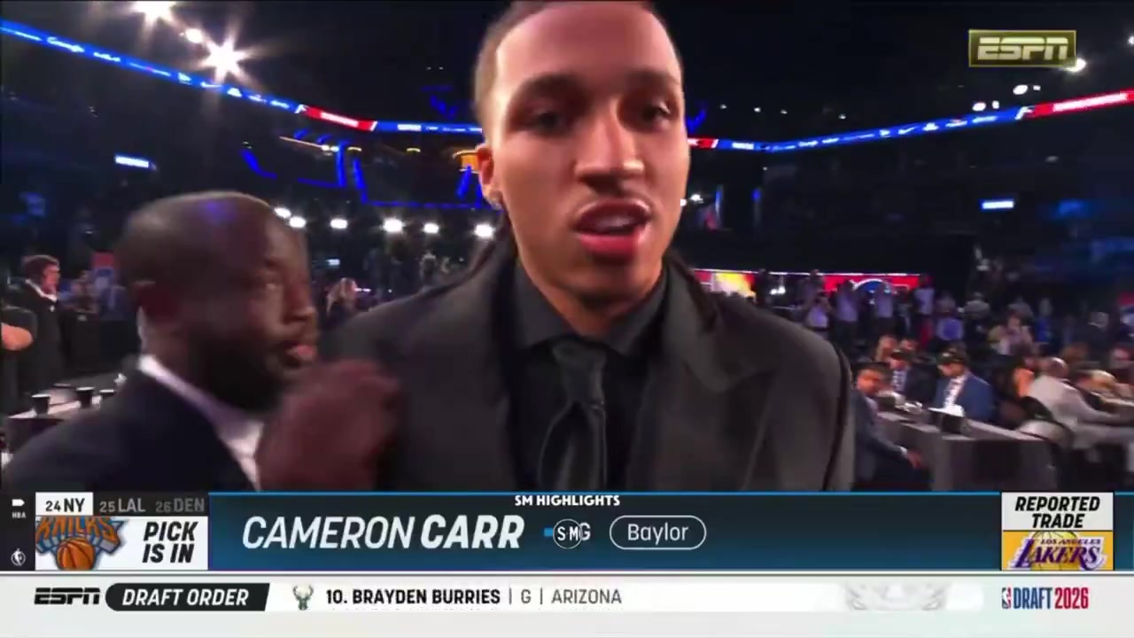 Cameron Carr says I'm being traded I'm being traded as he walks up to the podium to greet Adam Silver after being drafted