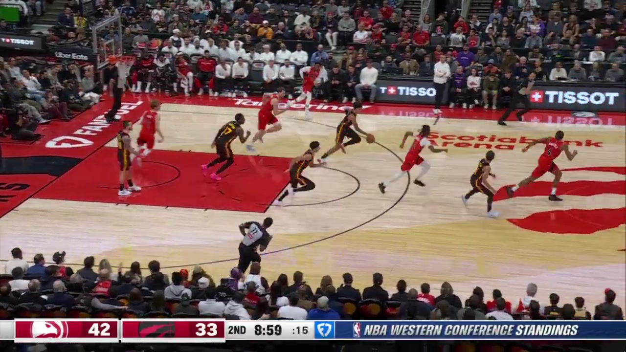 After stealing the ball and pushing to the hoop Jalen Johnson loses control of the ball mid-dunk but recovers it in time for the slam