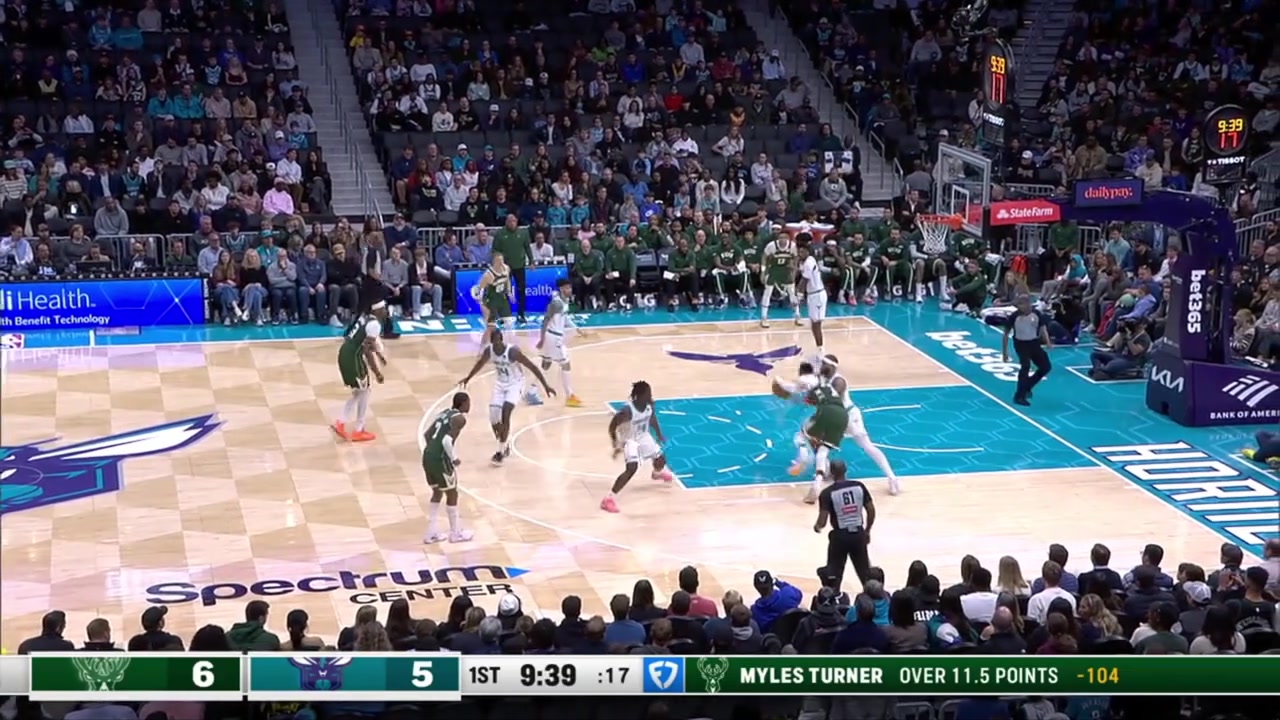 Giannis Antetokounmpo throws down a left-handed hammer dunk over Miles Bridges