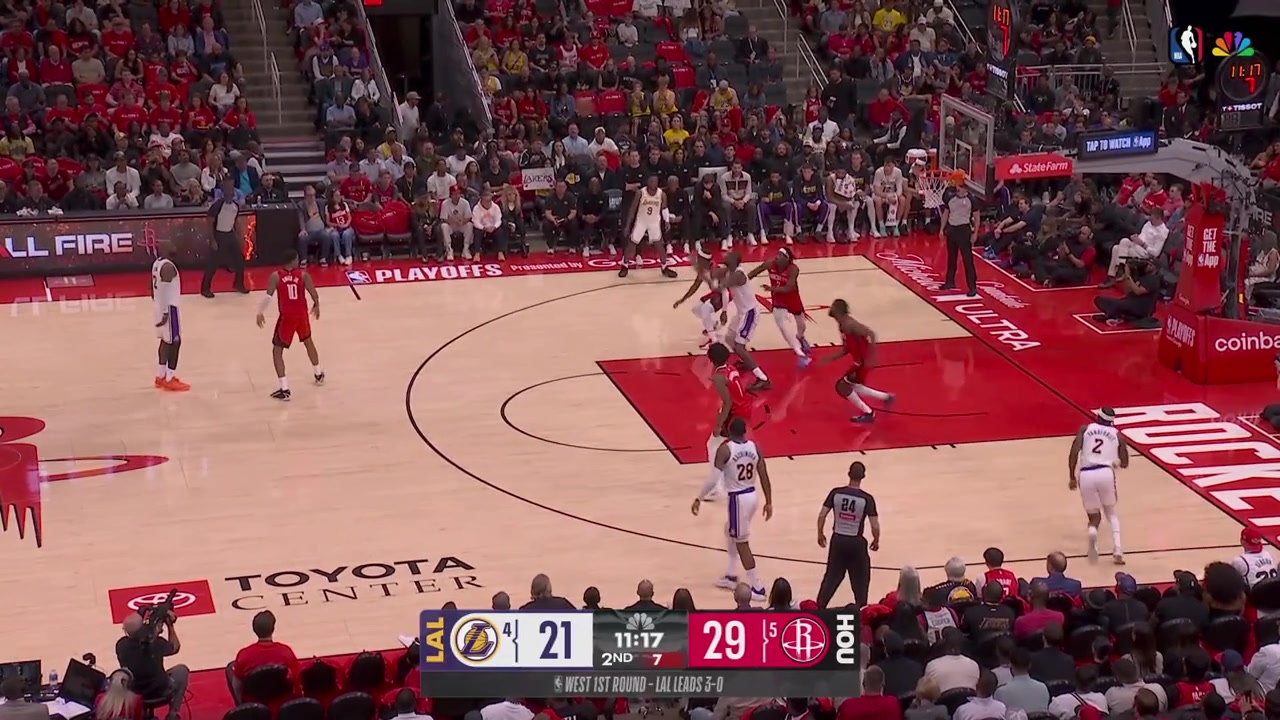Bronny James lobs the ball from behind the backboard to Deandre Ayton for the alley-oop layup to beat the shot clock