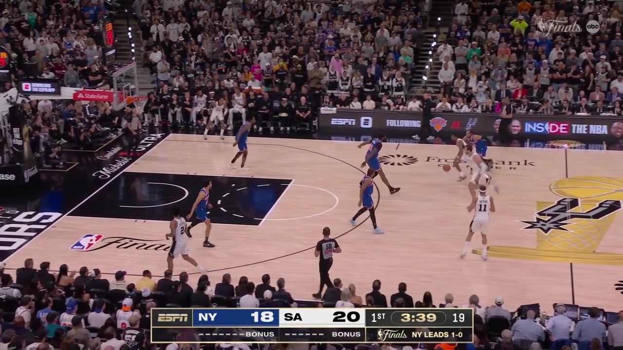 De'Aaron Fox banks in the shot off a broken play by the Spurs