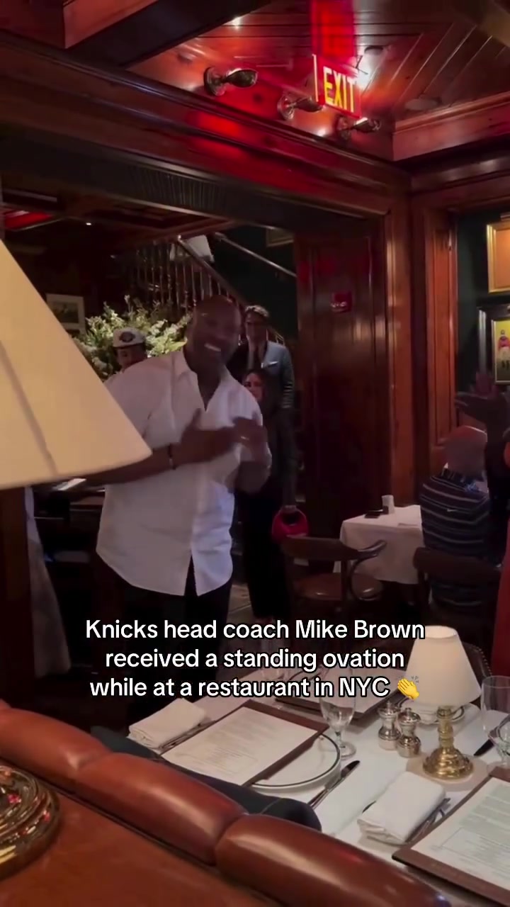 Mike Brown gets a hero's welcome and a chorus of Who Let The Dogs Out at a restaurant in NYC