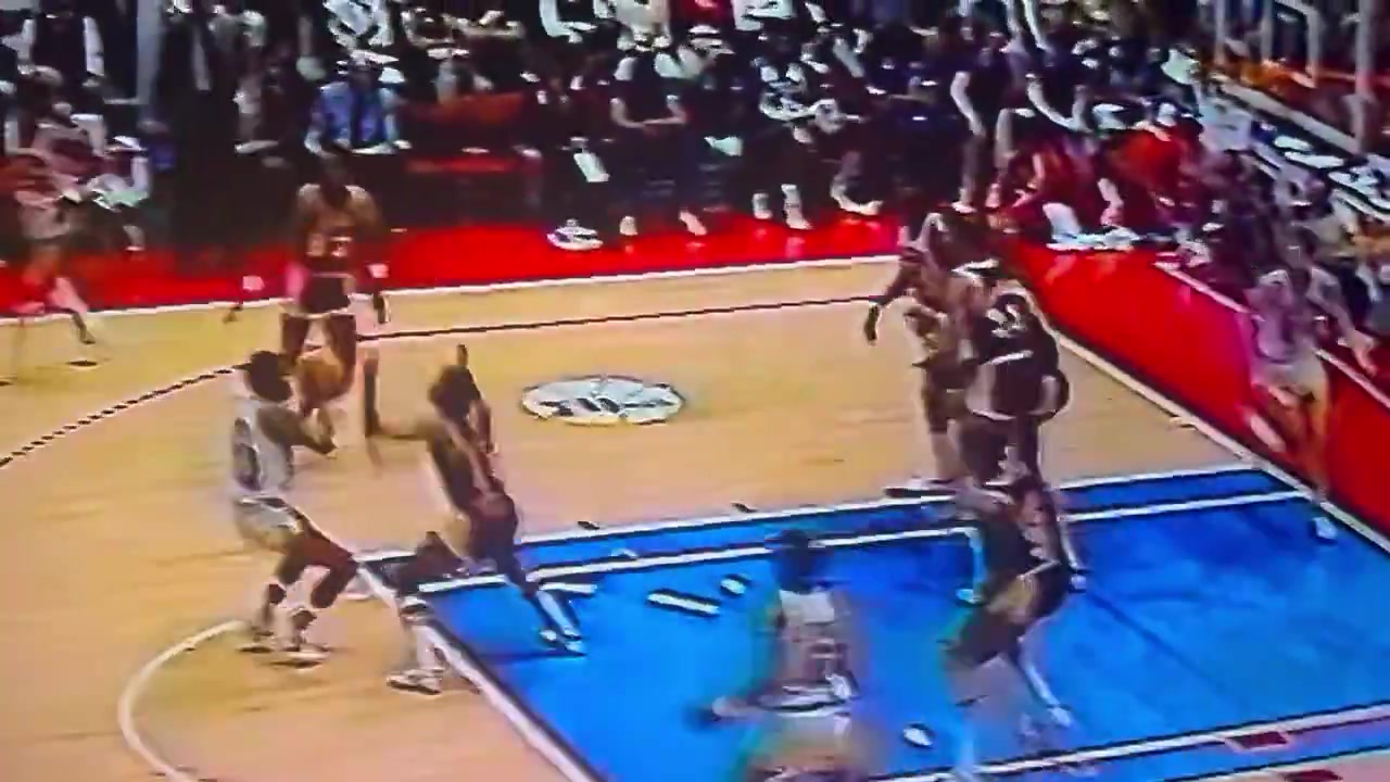 Magic Johnson dunks on Julius Irving in Game 1 of the 1983 NBA Finals but is called for an offensive foul