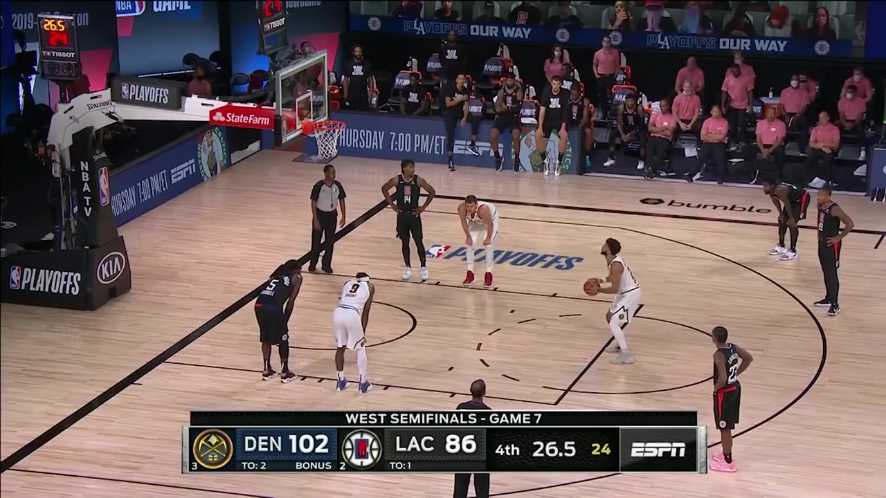 The Clippers players look on in despair as they blow a 3-1 lead to the Nuggets