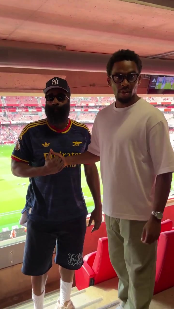 Jurrin Timber Arsenal signs on a jersey for James Harden