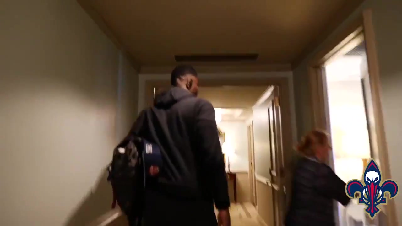 Zion Williamson reacts to receiving a signed jersey and the proverbial "torch" from Drew Brees