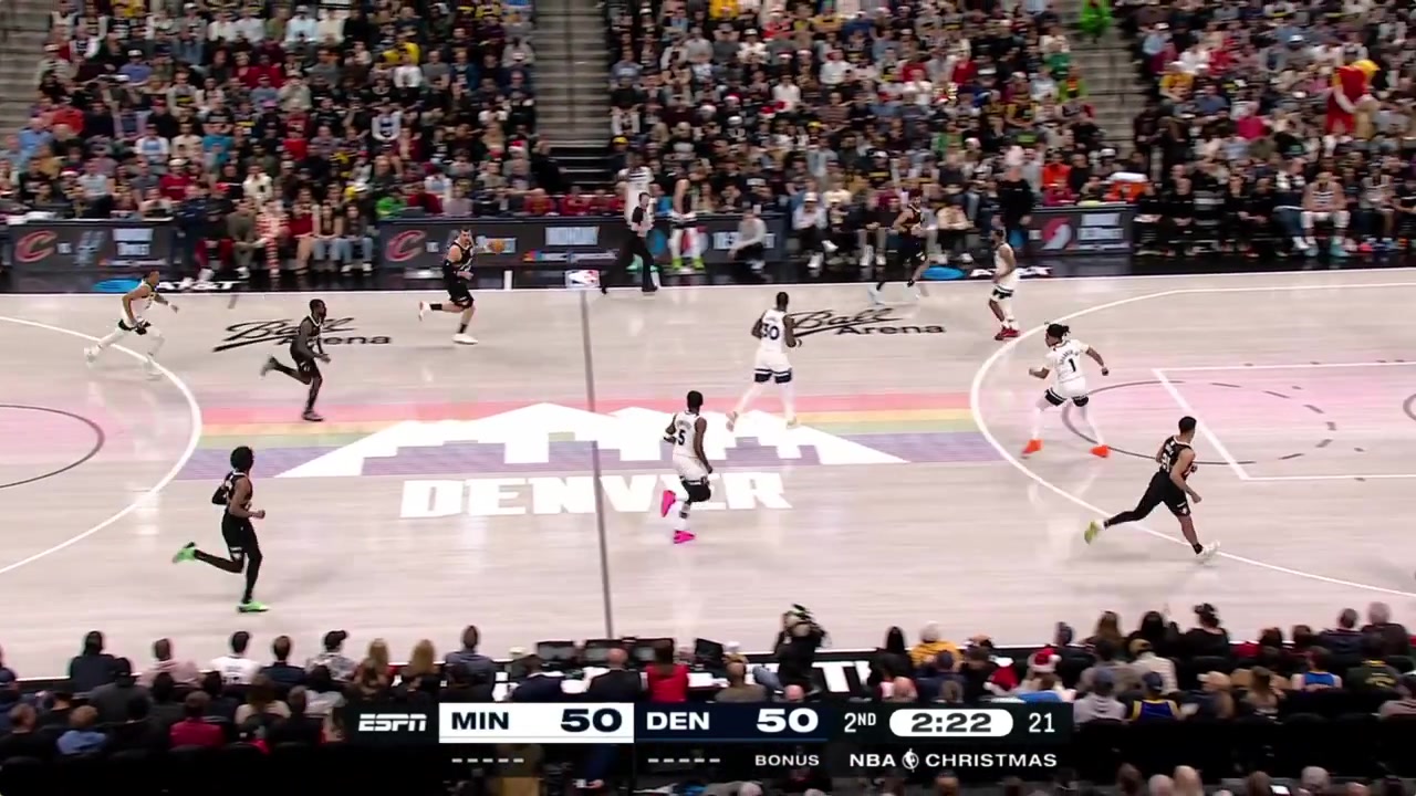 Nikola Joki a no-look pass to Tim Hardaway Jr under the basket for an easy score