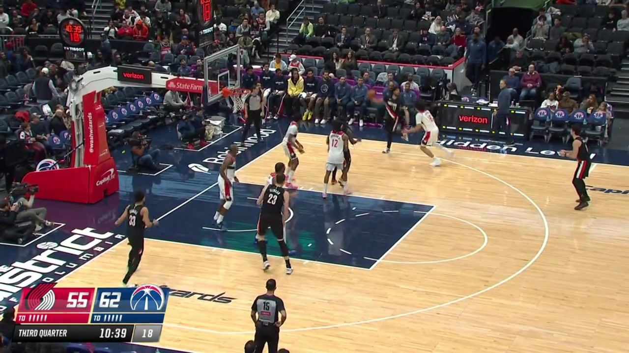 Deni Avdija misses the drive the ball gets to him while he is sitting on the floor and he finds Toumani Camara for the 3-pointer