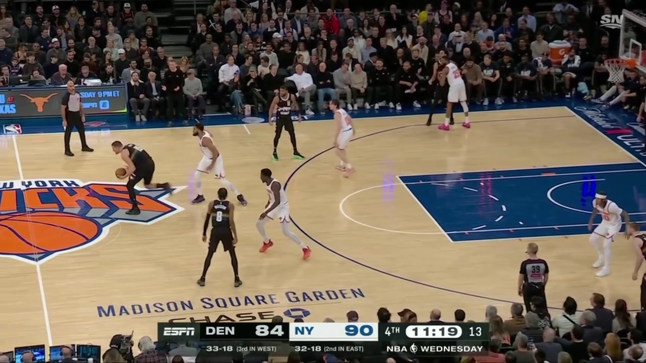 Nikola Joki hand-offs to Julian Strawther and sets the screen for the and-one drive marking Joki's 9th assist with 0 turnovers
