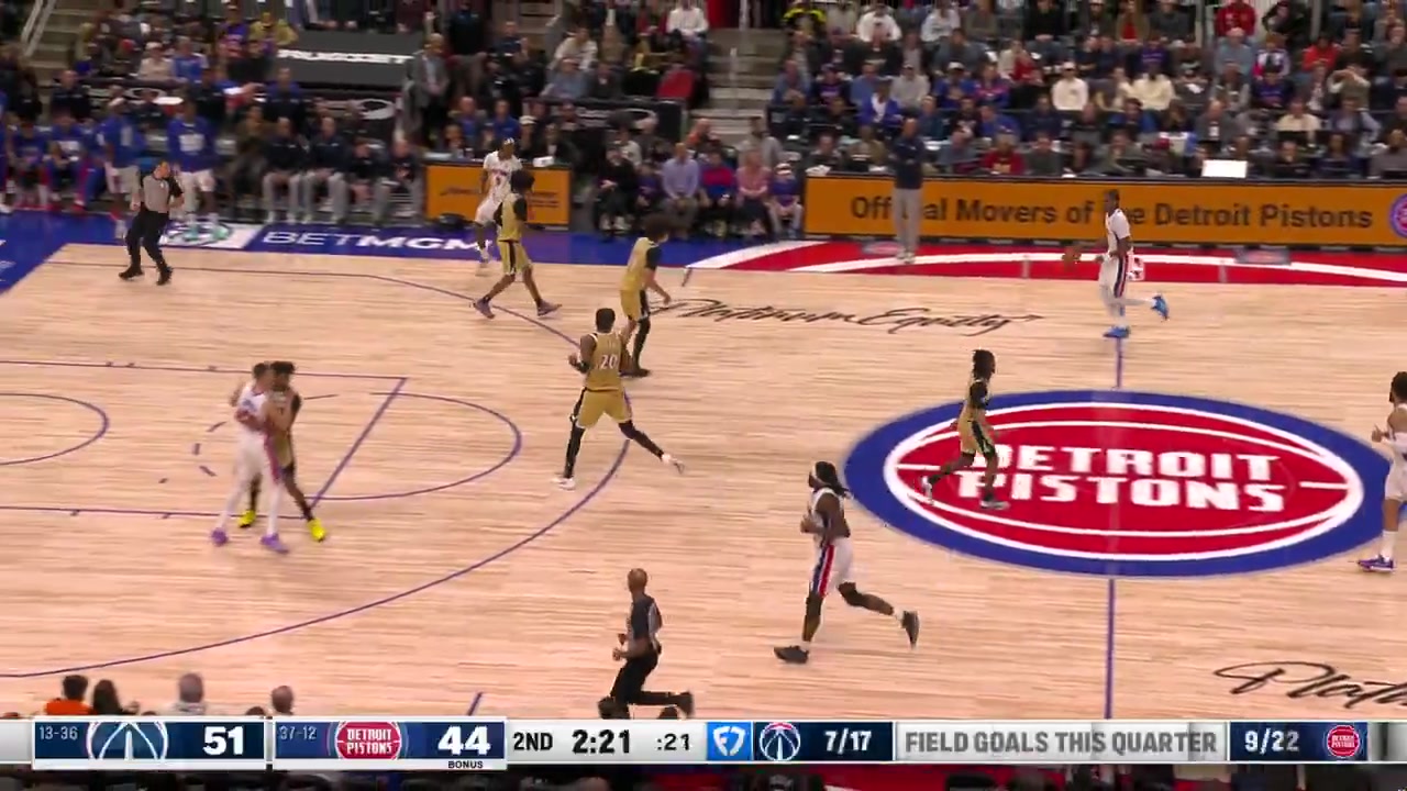 Cade Cunningham takes the handoff spins past his defender and finishes off the glass for the bucket during Detroit's 23-3 run against Washington
