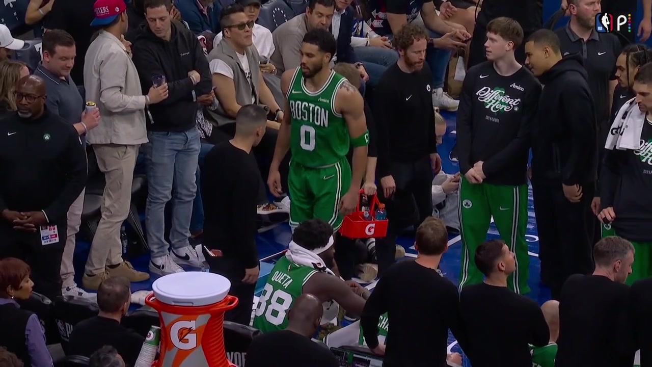 Jayson Tatum doing some workout during a timeout