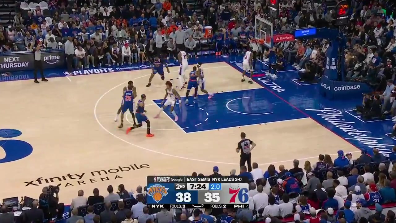 Mitch Robinson completes the baseline alley-oop play and yams it over Embiid